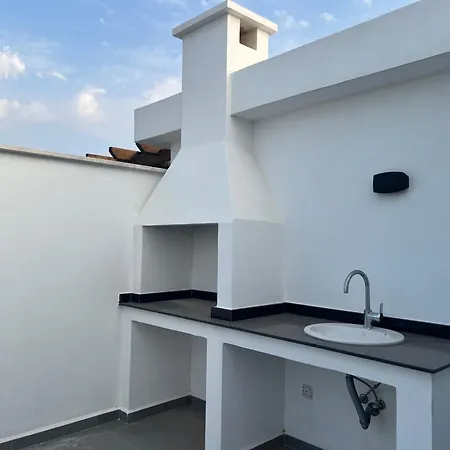 Atlantis Malibu By Carrington Akanthou